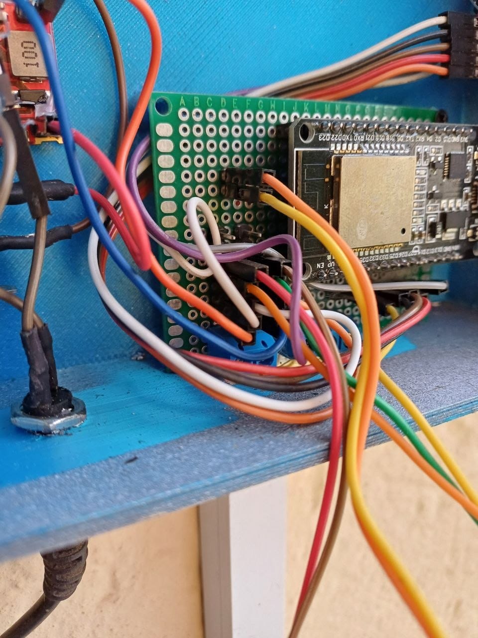 A close up of the ESP32 devkit board showing the ESP32-WROOM-32 module and the pin labels on the board