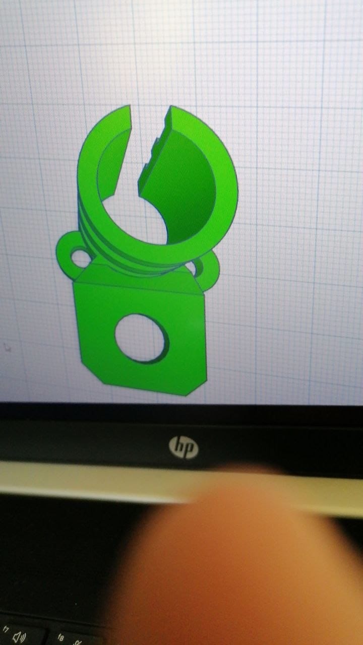 The 3D printed bracket in the CAD software on my laptop, showing the clamp ring, the screw lugs and the hole for the temperature probe