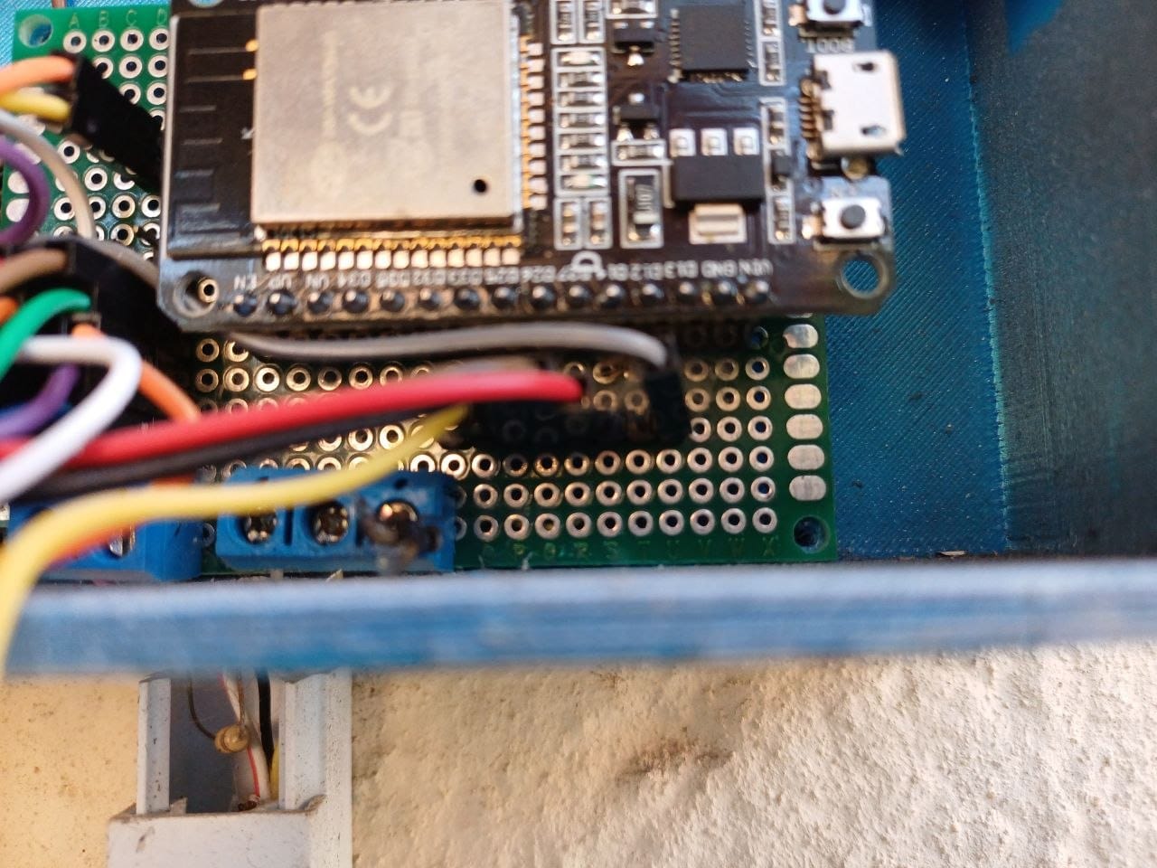 The ESP32 board and protoboard from the other side, with the terminal block and outgoing wires