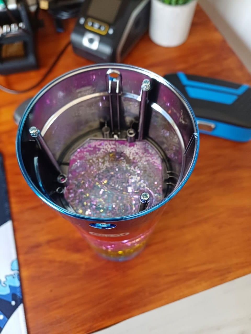 Looking down into the open lamp tube showing the propeller and settled glitter